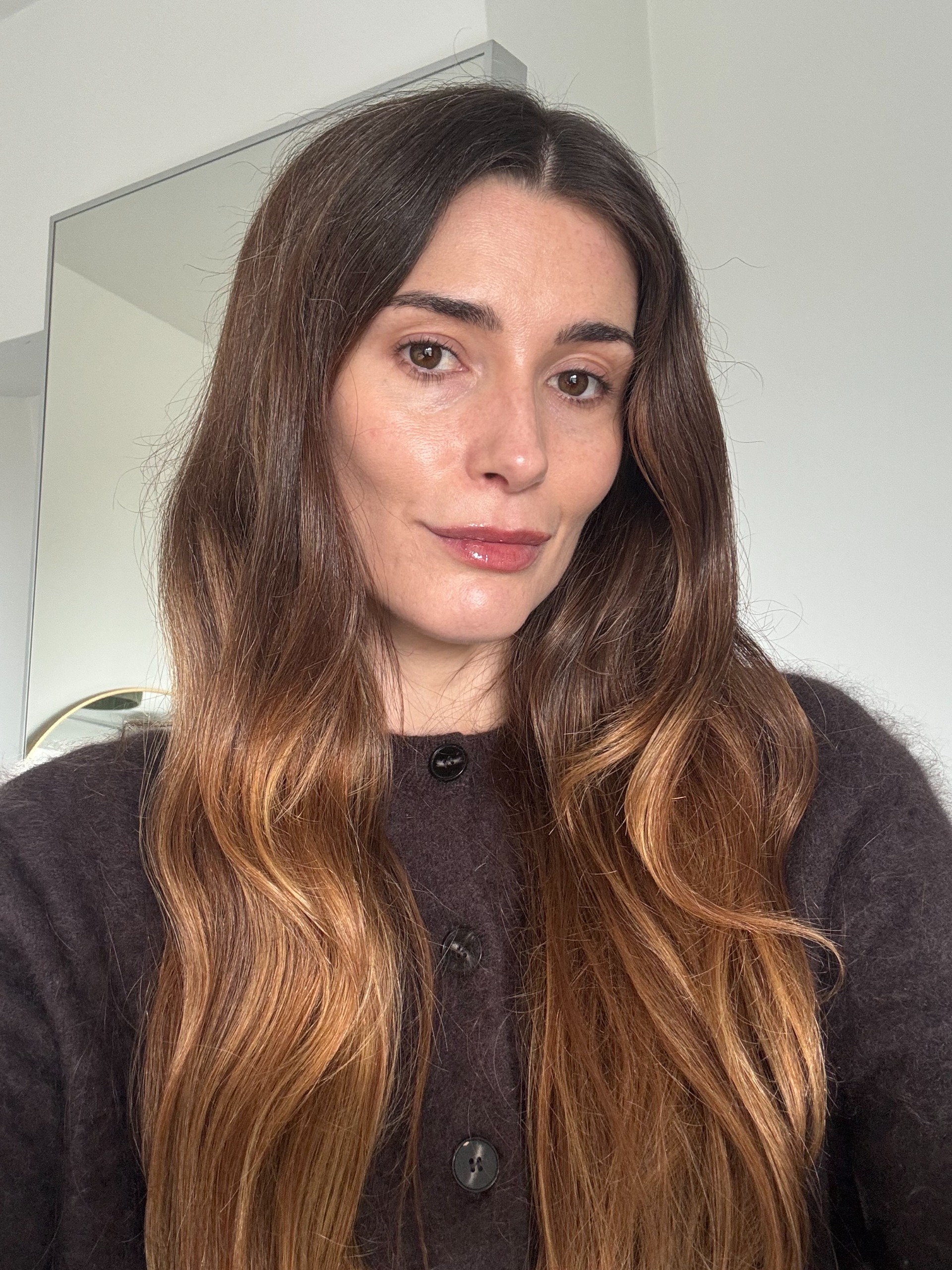 Eleanor wearing the Violette_FR Balm Amour lip balm in Dahlia Noir, a sheer berry brown