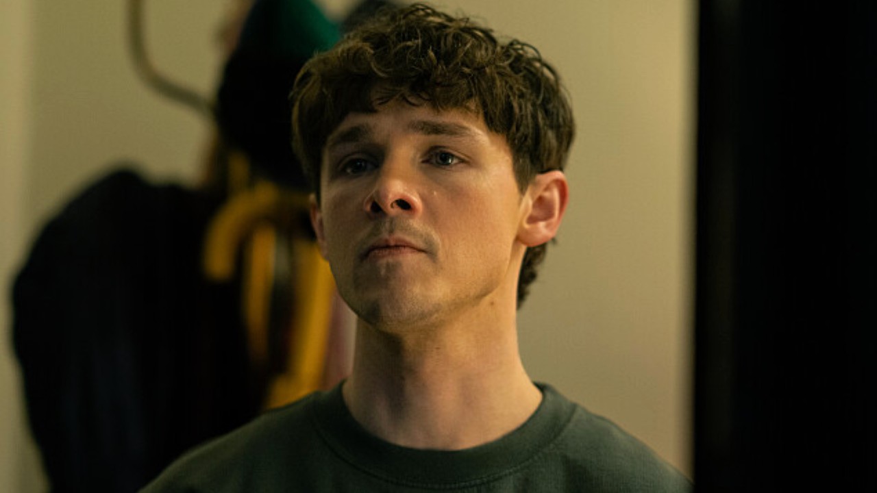 Harrison looking serious at a slumlord