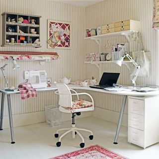 craft room with sewing machine and laptop