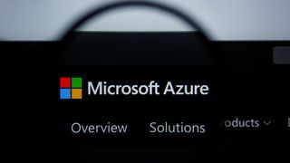 Microsoft Azure logo on a black background through a magnifying glass