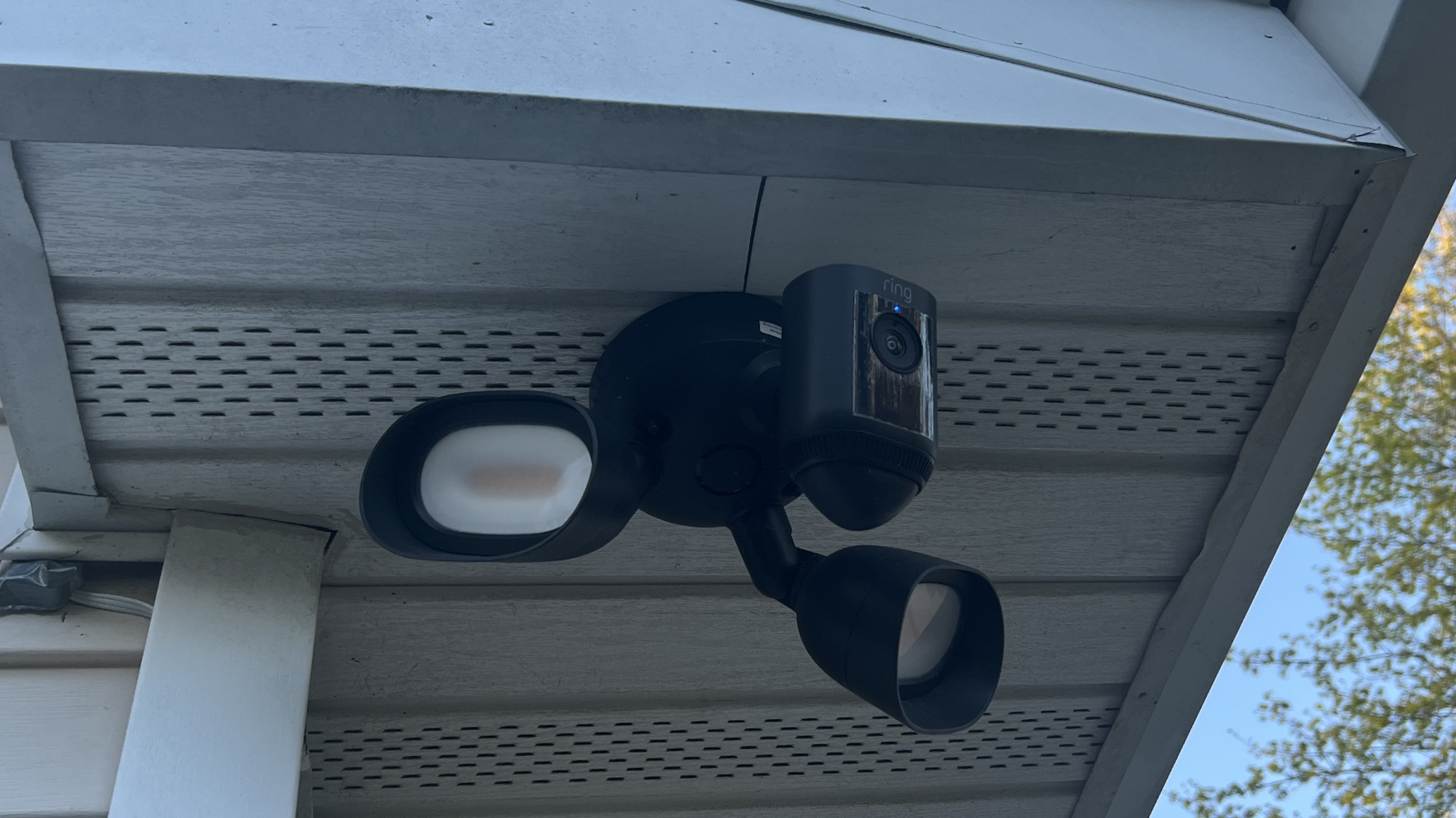 Ring Floodlight Wired Plus on apartment roof eave