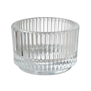 A ribbed clear tealight holder