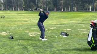 Tiger Woods hitting a drive at the range at Riviera ahead of the first round of the 2023 Genesis Invitational
