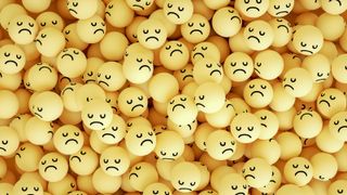 hundreds of yellow balls with sad faces