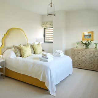 Beige, white and yellow bedroom