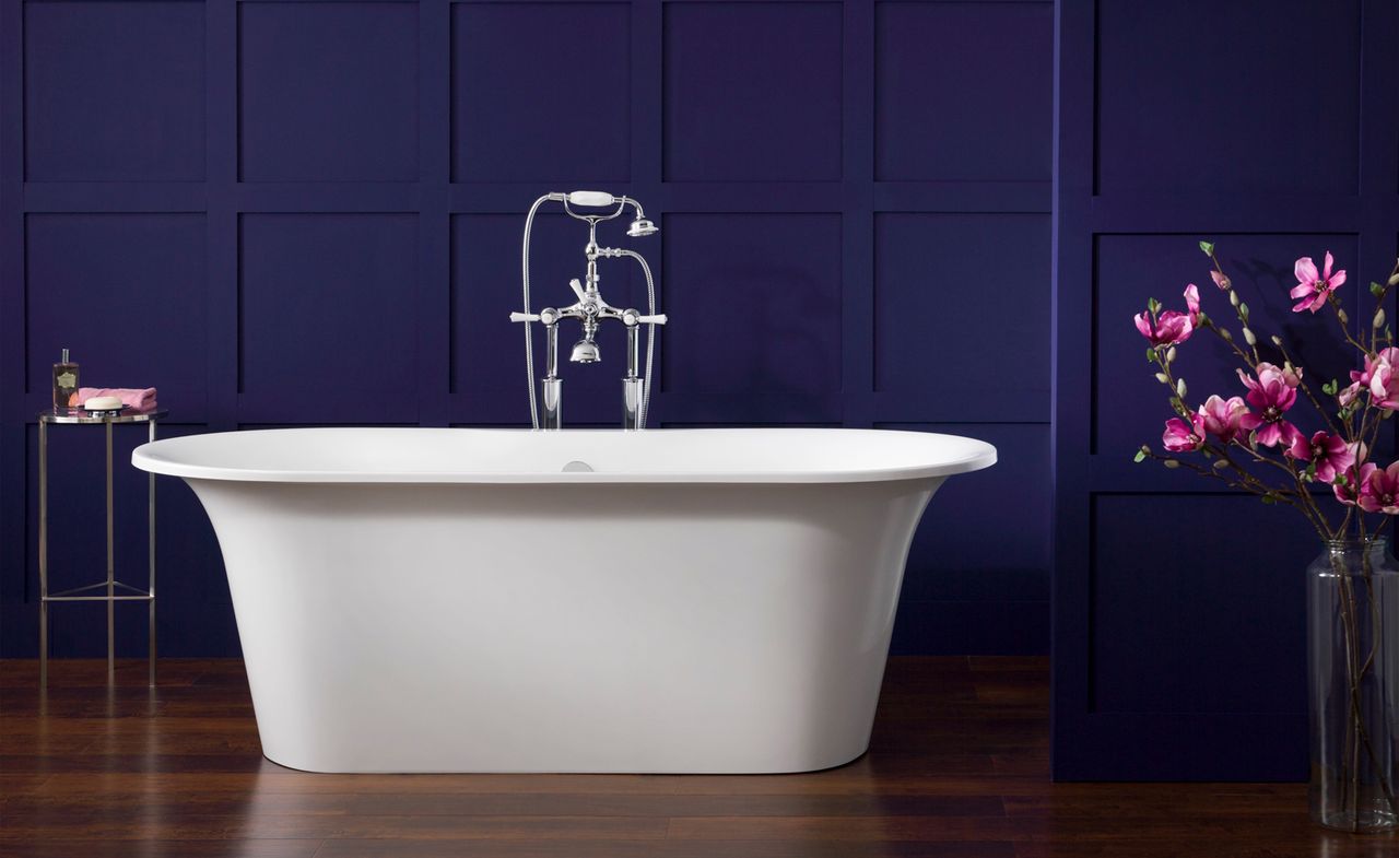 White freestanding bath in blue bathroom