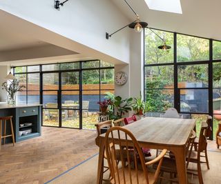 A wide ground floor extension with a pitched roof and crittal style windows and French doors