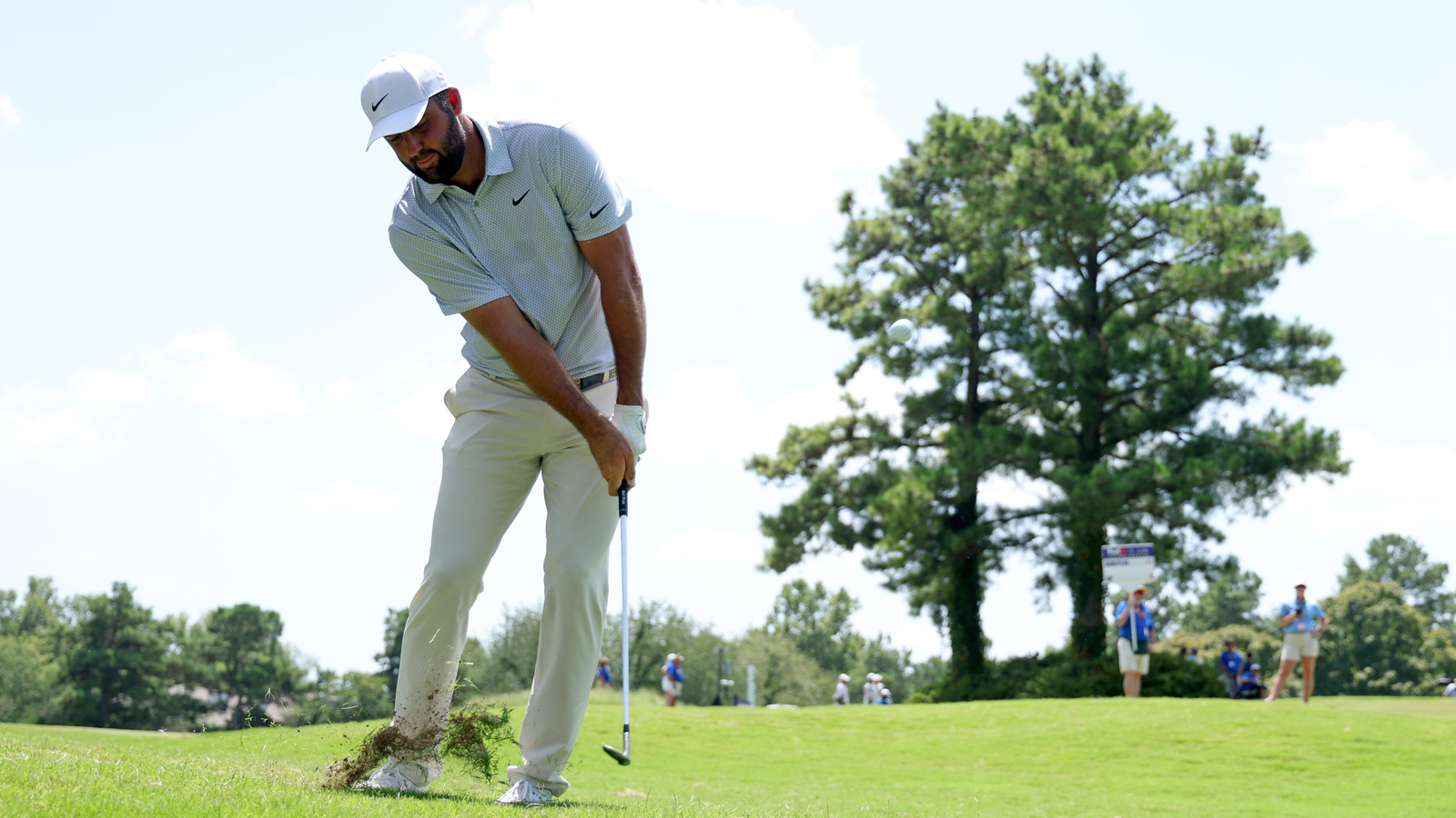 Scottie Scheffler hits a chip shot