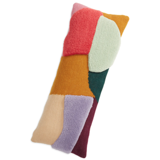 colorful rectangular pillow with abstract block pattern with different levels of tufting