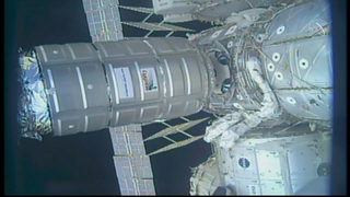 The CRS-11 Cygnus spacecraft preparing to undock from the space station and begin its secondary mission.