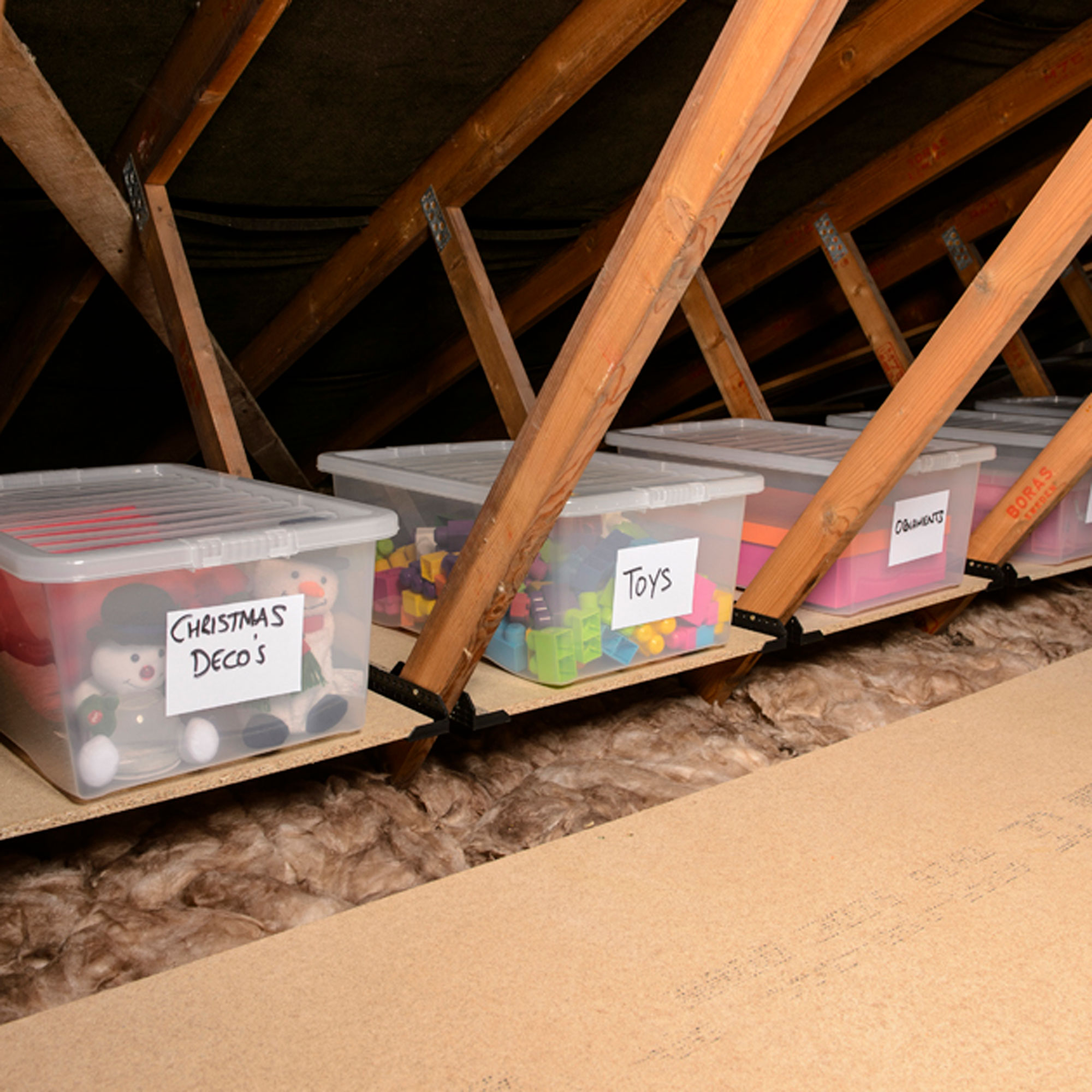 loft legs being used in attic beneath loft storage boxes