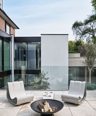 modern outdoor seating around a fire pit