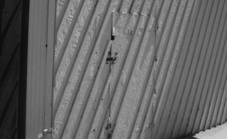 photo of a gray wooden doorway