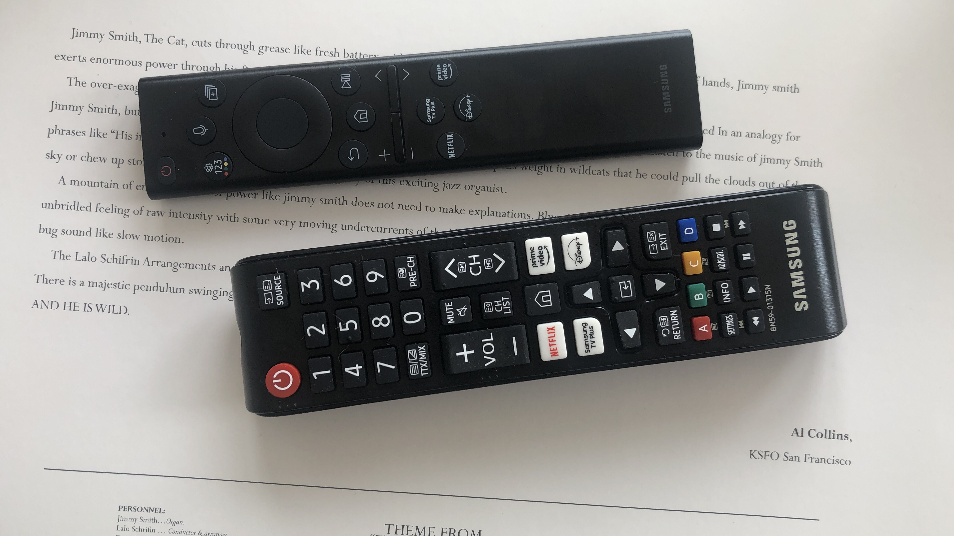 Samsung QN85B TV remotes on a table