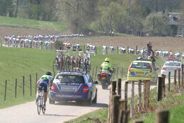 As with all tough Classics, it's not long before riders start falling out the peloton's rear.