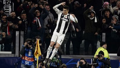 Cristiano Ronaldo celebrates scoring a hat-trick for Juventus against Atletico Madrid 