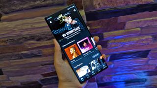 Amazon Music app on an Android phone held in one hand