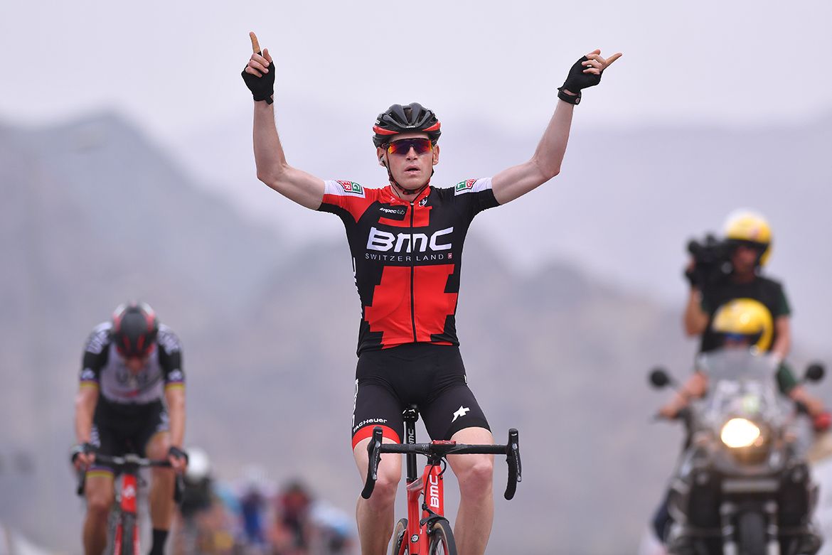 Ben Hermans raises his arms in celebration