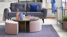 A contemporary living room with plush grey-purple velvet sofa and pink velvet sectional ottoman coffee table decor