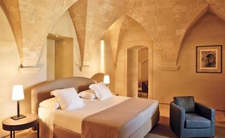 Bedroom interior with natural stone walls