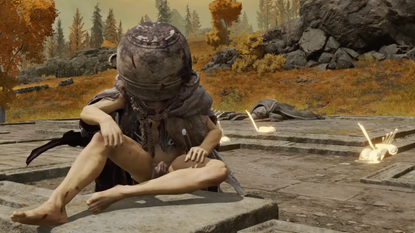 Let Me Solo Her sits cross-legged on the ground