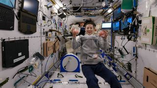 Chinese astronaut Wang Yaping juggling with apples aboard the Tianhe space station.