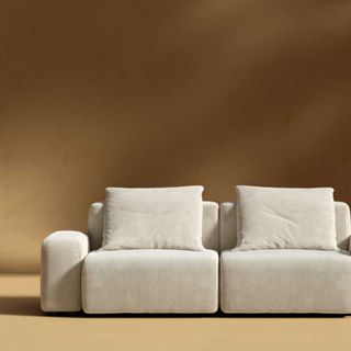 kaye sofa from rove concepts on a yellow background