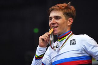 Remco Evenepoel shows off his rainbow jersey on the podium in Australia