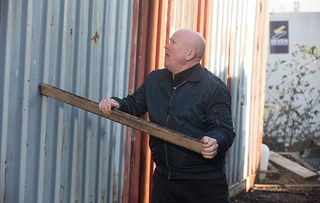 EastEnders Phil Mitchell bangs on a shipping container