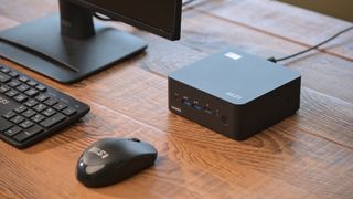 MSI Cubi NUC 1M mini PC on a wooden desk