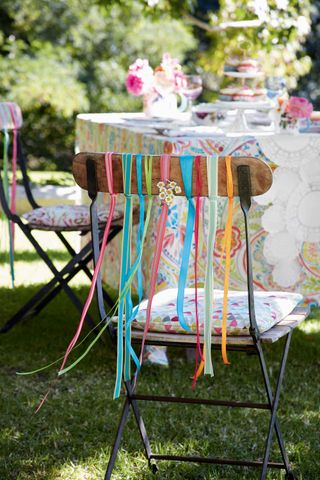 chairs with decorative paper streamers in garden