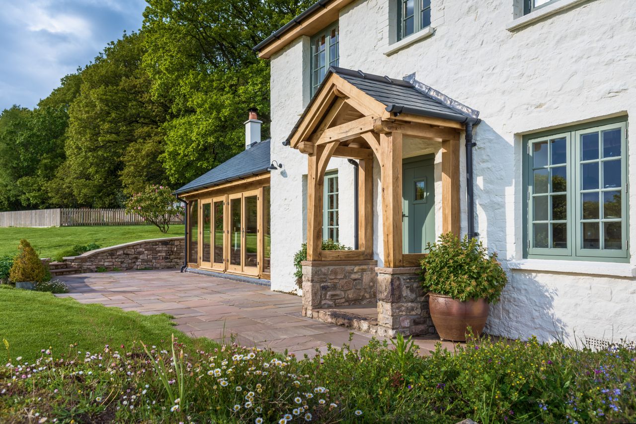 oak frame porch on white rendered cottage