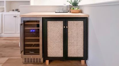 A cane-panelled bar with a fridge