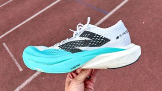 Person holding the New Balance FuelCell SuperComp Pacer v2