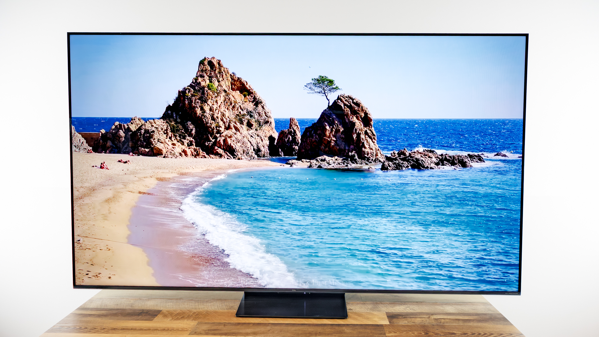 TCL QM7L 75-inch TV on a desk