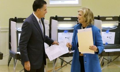 Mitt Romney and his wife Ann Romney vote at a polling station