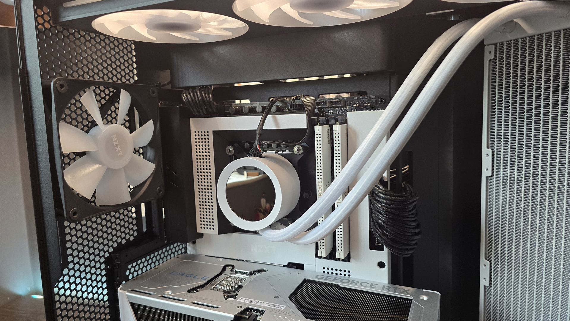 The NZXT Kraken Plus 360 RGB liquid cooler installed in a test bench.