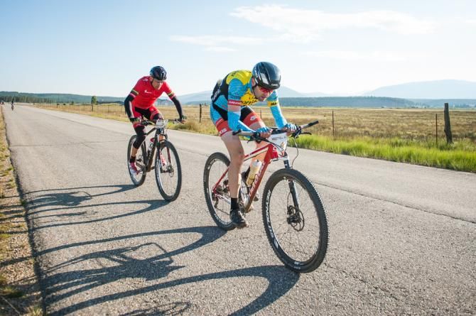 Yes, mountain bike racers do get some asphalt time in the Leadville 100 MTB. Cameron Cogburn (SmartStop) pulling while Christoph Sauser (Specialized) sits on his wheel and takes in the draft before his next pull.