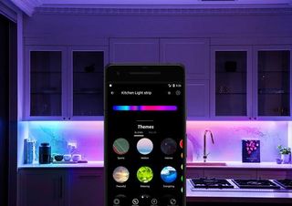 LIFX smartphone app in a kitchen illuminated with LIFX smart lights