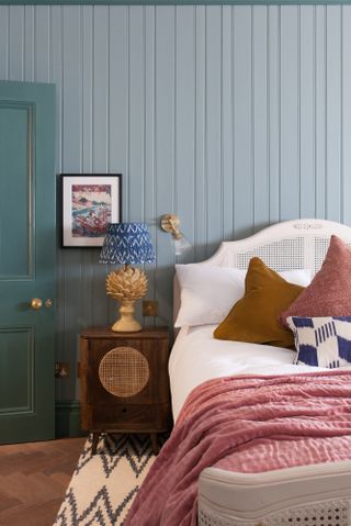 Blue apartment bedroom with panelling