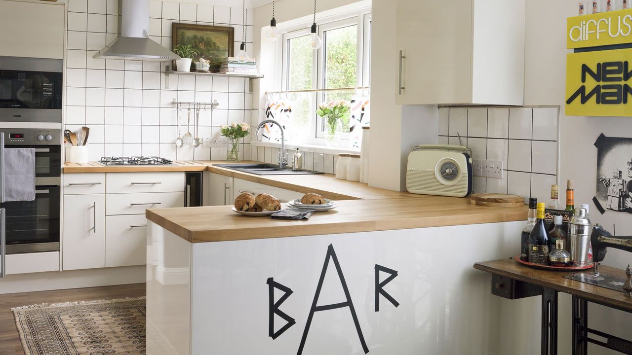 kitchen with tiled walls and wooden flooring 