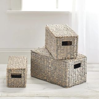 Three wicker baskets with lids
