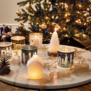 M&S light up candles on marble table