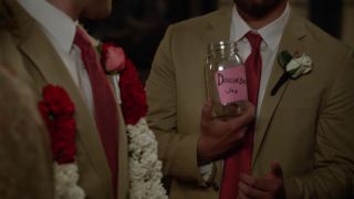 Nick hands Schmidt the Douchebag Jar at his wedding