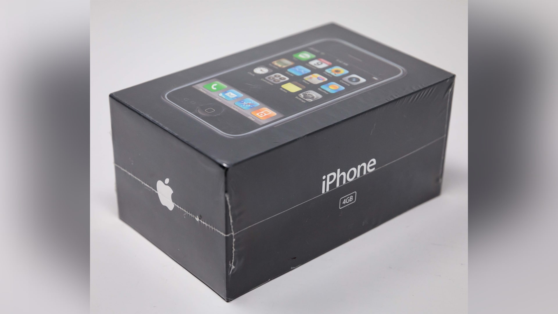 An original 4GB iPhone sealed in its packaging.