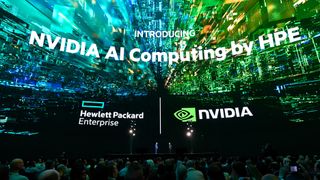 The words 'INTRODUCING NVIDIA AI Computing by HPE' on a giant screen above the keynote stage of HPE Discover 2024. Beneath the words, the Hewlett Packard Enterprise and Nvidia logos sit side by side, above a stage on which stands Antonio Neri, CEO at HPE and Jensen Huang, CEO at Nvidia.