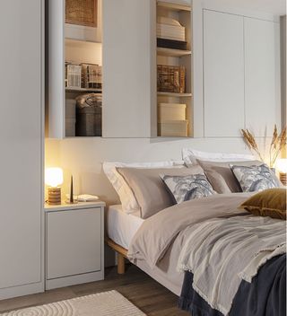 grey fitted wardrobes over bed