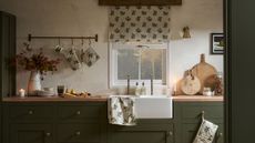 A kitchen with a large white farmhouse sink