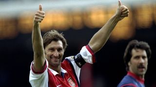 16 May 1999: Tony Adams of Arsenal salutes the fans during the FA Carling Premiership match against Aston Villa played at Highbury in London, England. The match finished in a 1-0 win for Arsenal, however, Arsenal were not able to clinch the Premiershiptitle. \ Mandatory Credit: Ben Radford /Allsport