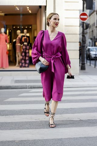COLOGNE, GERMANY - MAY 12: Sarah Achterholt wearing pink Zara dress, black Isabel Marant pouch bag and black Manebi slides via The Wants Shoes on May 12, 2021 in Cologne, Germany. (Photo by Jeremy Moeller/Getty Images)